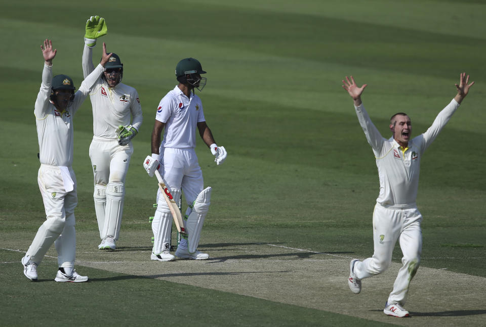 Australia's Marnus Labuschagne, right, appeals the dismissal of Pakistan's Fakhar Zaman during their test match in Abu Dhabi, United Arab Emirates, Tuesday, Oct. 16, 2018. (AP Photo/Kamran Jebreili)