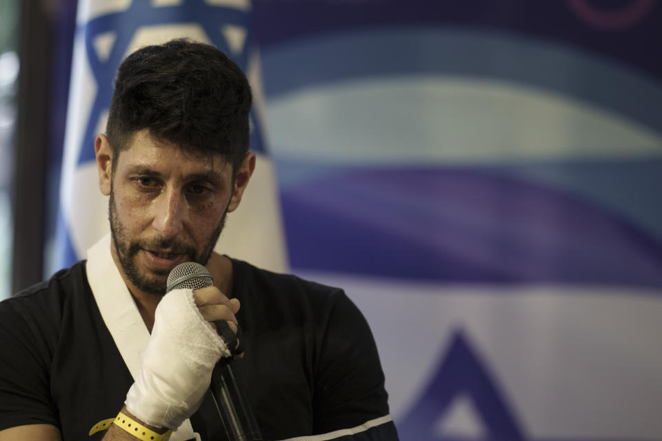 The actor Idan Amedi, well known for his role in the Netflix series "Fauda", talks to the journalists during a press conference at the Sheba Medical Center in Ramat Gan, Israel, Thursday, Jan. 25, 2024, after been released from the hospital where he was treated from his injuries after being wounded while fighting in the Gaza Strip. (AP Photo/Leo Correa)