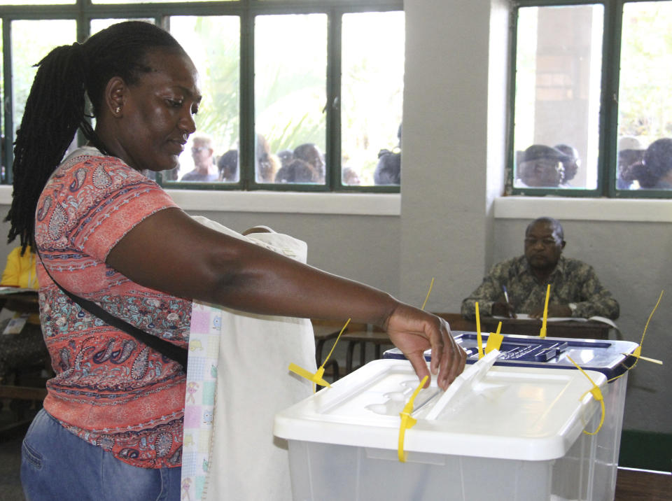 A woman casts her vote in Maputo, Tuesday, Oct. 15, 2019, in the country's presidential, parliamentary and provincial elections. Polling stations opened across the country with 13 million voters registered to cast ballots in elections seen as key to consolidating peace in the southern African nation. (AP Photo/Ferhat Momade)