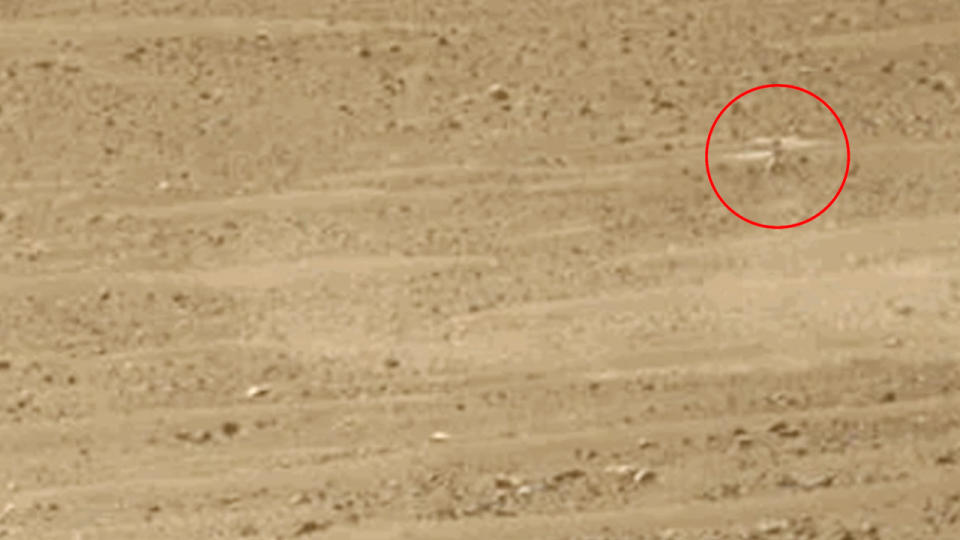 zoomed-in photo of martian surface with ingenuity helicopter circled for clarity