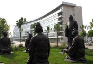 Sculptures of Confucius with his students are seen near the office buildings of Chambroad Petrochemicals in Boxing, Shandong Province, China, May 10, 2016. REUTERS/Meng Meng