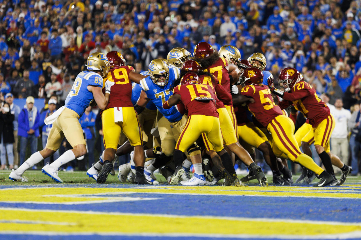 PASADENA, CA - NOVEMBER 19: USC Trojans defensive unit group tackle during the NCAA college football game between the USC Trojans and the UCLA Bruins on November 19, 2022 at the Rose Bowl Stadium in Pasadena, CA. (Photo by Ric Tapia/Icon Sportswire via Getty Images)