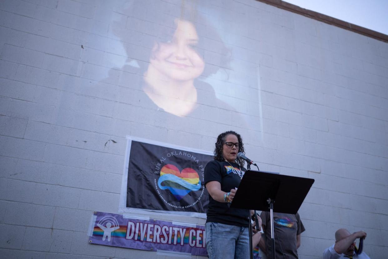 A woman speaks during a candlelight vigil for 16-year-old nonbinary student Nex Benedict on Feb. 24, 2024, in Oklahoma City. <a href="https://www.gettyimages.com/detail/news-photo/kendra-wilson-clements-speaks-during-a-candlelight-vigil-news-photo/2028797789?adppopup=true" rel="nofollow noopener" target="_blank" data-ylk="slk:J Pat Carter/Getty Images;elm:context_link;itc:0;sec:content-canvas" class="link ">J Pat Carter/Getty Images</a>