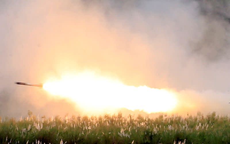 FILE PHOTO: U.S. military forces fire a High Mobility Artillery Rocket System (HIMARS) rocket during the annual Philippines-US live fire amphibious landing exercise (PHIBLEX) at Crow Valley in Capas, Tarlac province, north of Manila