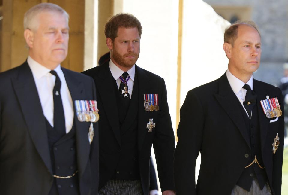 Britain's Prince Harry, Duke of Sussex, (C) attends with Britain's Prince Andrew, Duke of York, (L) and Britain's Prince Edward, Earl of Wessex, the ceremonial funeral procession of Britain's Prince Philip, Duke of Edinburgh to St George's Chapel in Windsor Castle in Windsor, west of London, on April 17, 2021. - Philip, who was married to Queen Elizabeth II for 73 years, died on April 9 aged 99 just weeks after a month-long stay in hospital for treatment to a heart condition and an infection. (Photo by CHRIS JACKSON / various sources / AFP) (Photo by CHRIS JACKSON/AFP via Getty Images)