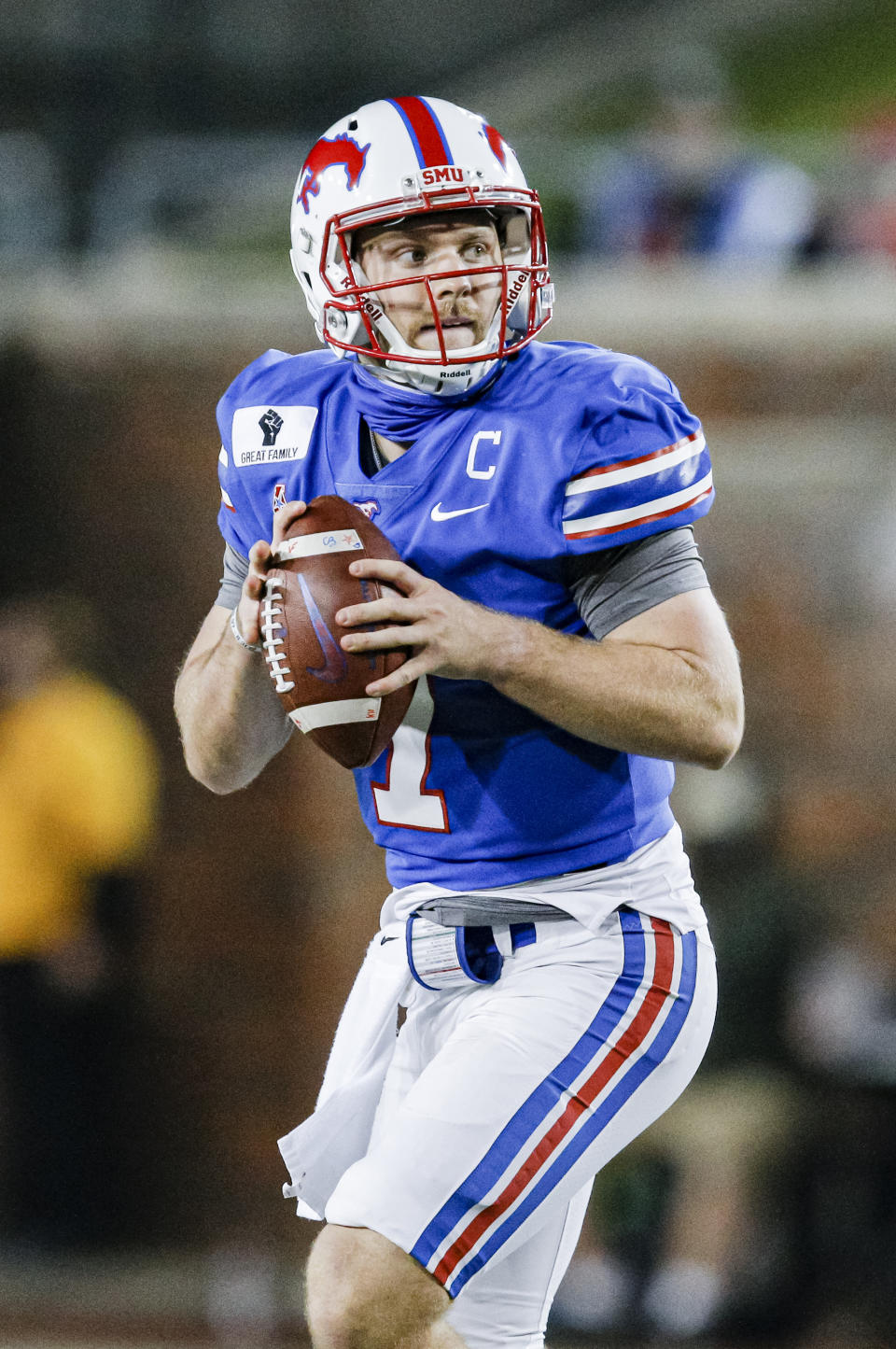 SMU quarterback Shane Buechele (7) looks for an open receiver during the first half of an NCAA college football game against Navy, Saturday, Oct. 31, 2020, in Dallas. (AP Photo/Brandon Wade)