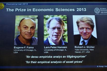 Photos of the 2013 Nobel Prize laureates in Economic Sciences Eugene Fama (L-R), Lars Peter Hansen and Robert Shiller are displayed during a news conference at the Royal Swedish Academy of Sciences in Stockholm October 14, 2013. REUTERS/Claudio Bresciani/TT News Agency