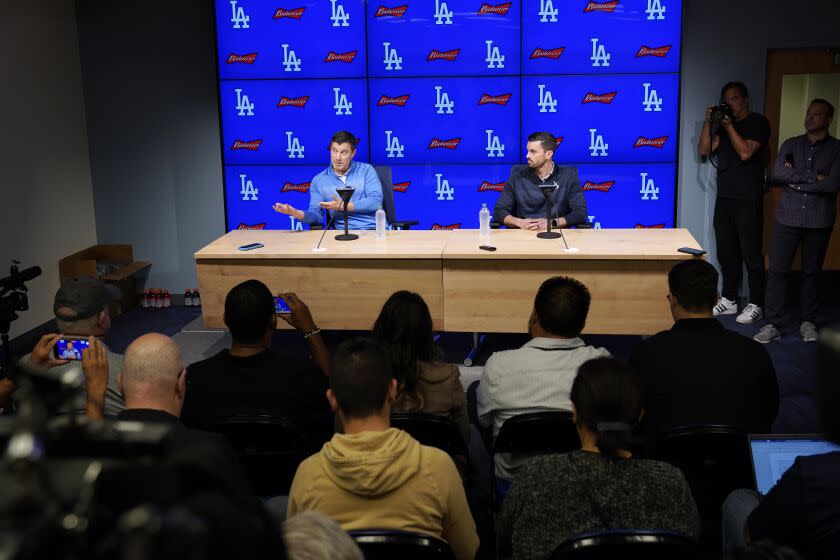 Los Angeles Dodgers President of Baseball Operations Andrew Friedman, left, and General Manager Brandon Gomes hold a baseball news conference Tuesday, Oct. 18, 2022, in Los Angeles. (AP Photo/Mark J. Terrill)