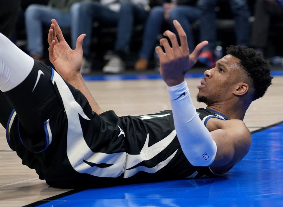 Milwaukee Bucks forward Giannis Antetokounmpo reacts after being called for a foul during the first half of their first-round playoff series game against the Miami Heat Sunday at Fiserv Forum. He injured his back in the first quarter, returned briefly but then was held out the rest of the game.