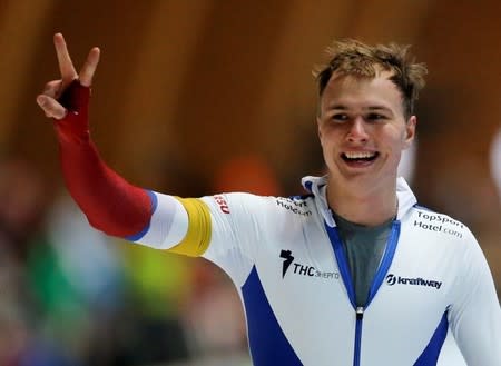 Russia's Pavel Kulizhnikov reacts after winning the men's 500m speedskating ISU World Cup Speed Skating Final competion in Erfurt March 21, 2015. REUTERS/Fabrizio Bensch