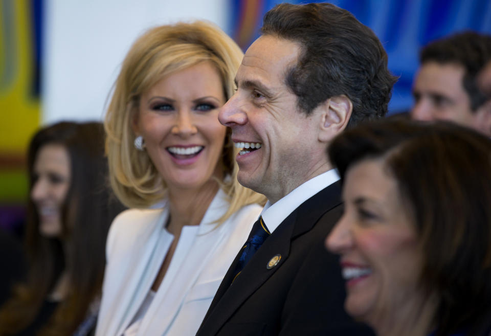 FILE- In this Jan. 1, 2015 file photo, New York Gov. Andrew Cuomo and his girlfriend Sandra Lee smile during an inaugural ceremony at One World Trade Center in New York. The couple have announced their break up after more than a decade together. Cuomo and Lee said in a statement Wednesday, Sept. 25, 2019, that their lives have gone in different directions but that they remain close friends. (AP Photo/Craig Ruttle, Pool, File)