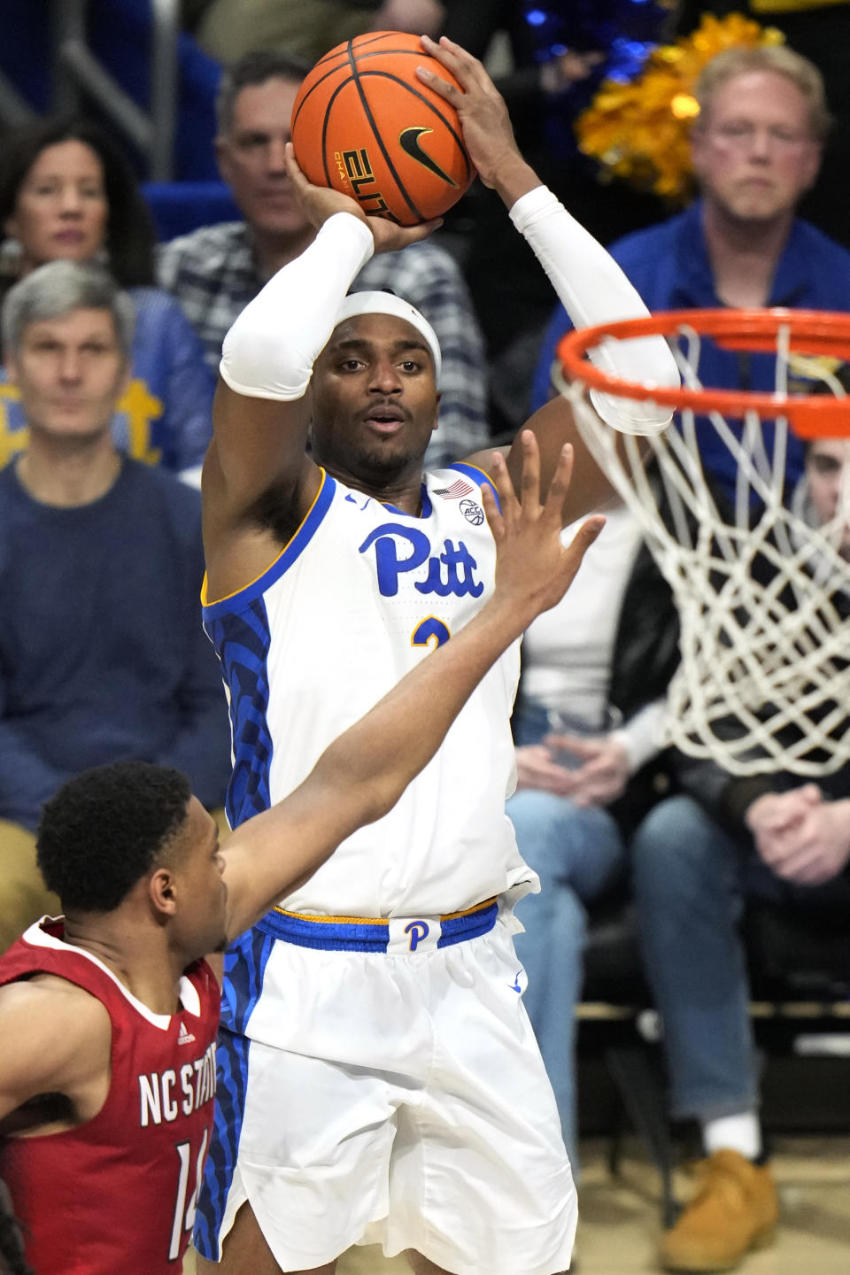 Pittsburgh's Blake Hinson shoots over North Carolina State's Casey Morsell (14) during the second half of an NCAA college basketball game in Pittsburgh Saturday, March 9, 2024. (AP Photo/Gene J. Puskar)