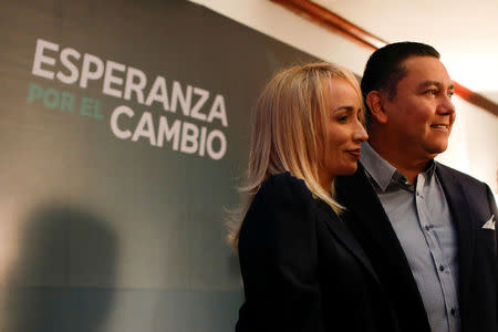 Venezuelan evangelical pastor and presidential pre-candidate Javier Bertucci (R) and his wife Rebeca de Bertucci pose for a photo after a news conference in Caracas, Venezuela, February 21, 2018. REUTERS/Marco Bello