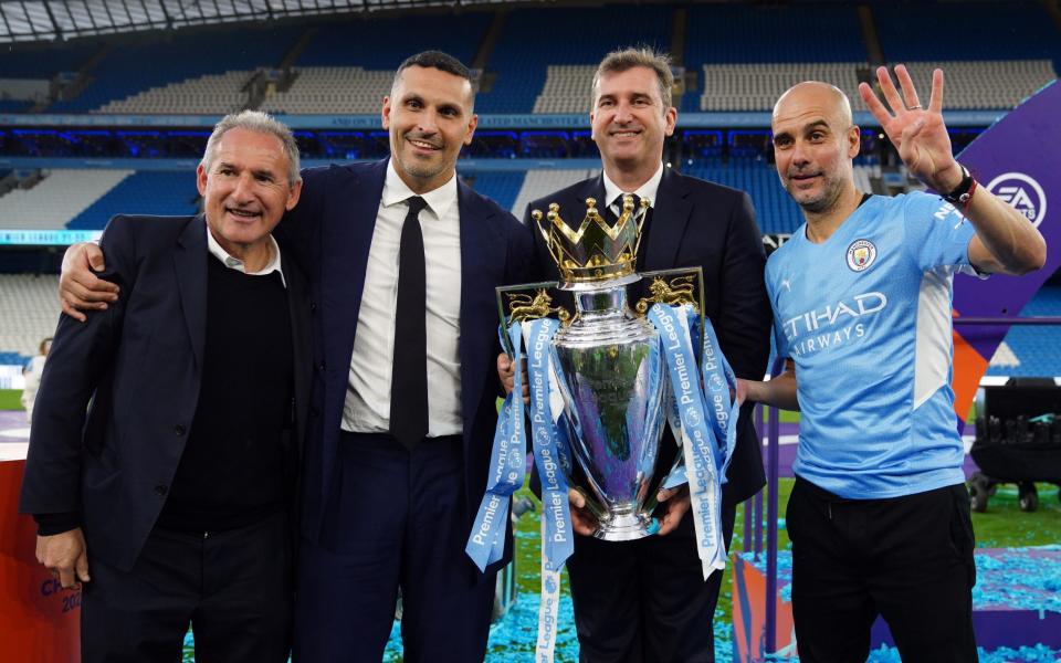 Pep Guardiola stands with Txiki Begiristain (L), Khaldoon Al Mubarak and Ferran Soriano - PA/Martin Rickett