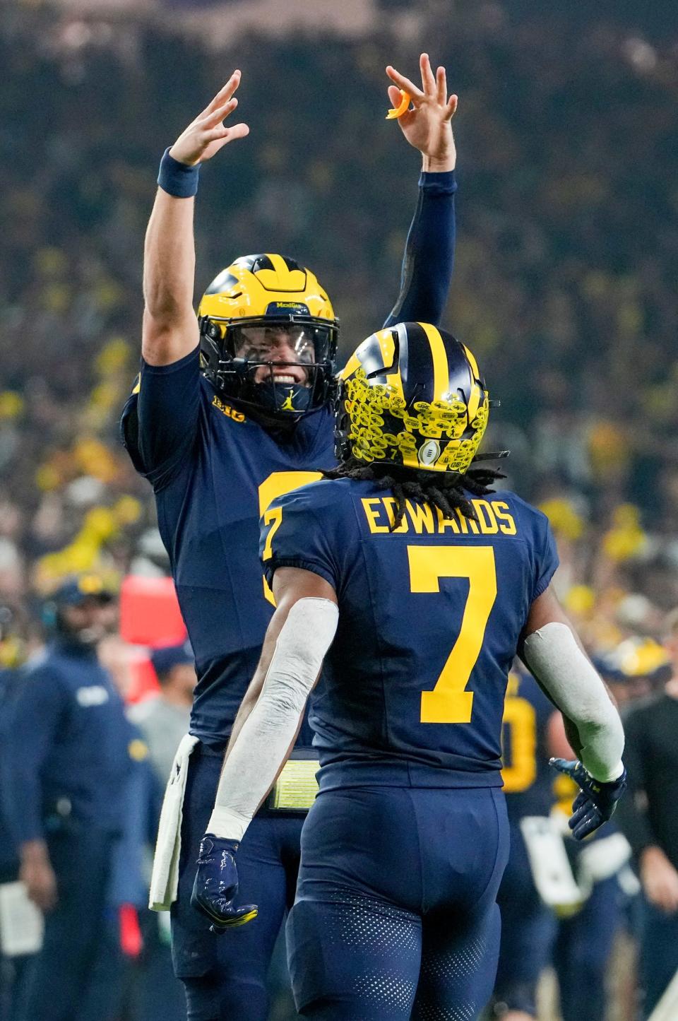 Michigan quarterback J.J. McCarthy celebrates with Michigan running back Donovan Edwards after a touchdown in the second quarter during the College Football Playoff national championship game against Washington at NRG Stadium in Houston, Texas on Monday, Jan. 8, 2024.