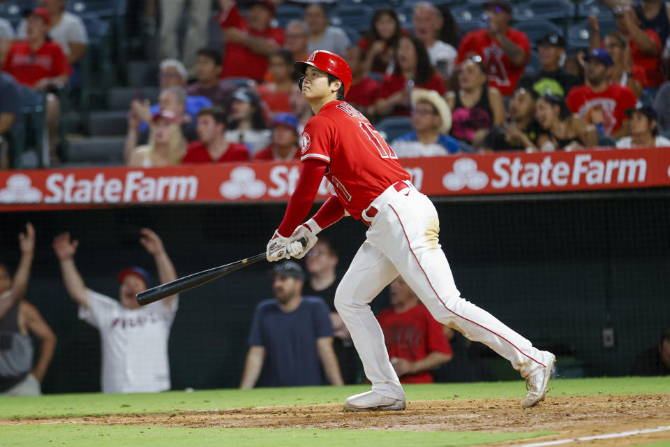 Los Angeles Angels' Shohei Ohtani watches his solo home run during the seventh inning of a baseball game against the Detroit Tigers in Anaheim, Calif., Monday, Sept. 5, 2022. (AP Photo/Ringo H.W. Chiu)