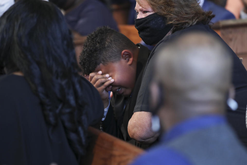 Tybre Faw becomes emotional after the reading of John Lewis' favorite poem, Invictus, during his funeral service at Ebenezer Baptist Church. / Credit: Alyssa Pointer / Getty Images