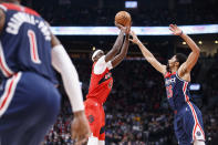 Toronto Raptors forward Pascal Siakam (43) shoots over Washington Wizards guard Spencer Dinwiddie (26) during first-half NBA basketball game action in Toronto, Sunday, Dec. 5, 2021. (Cole Burston/The Canadian Press via AP)