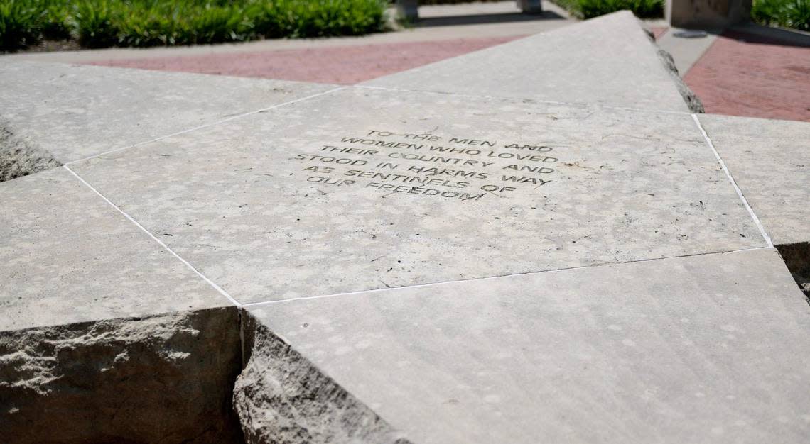 A giant, engraved stone star is at the center of this memorial.