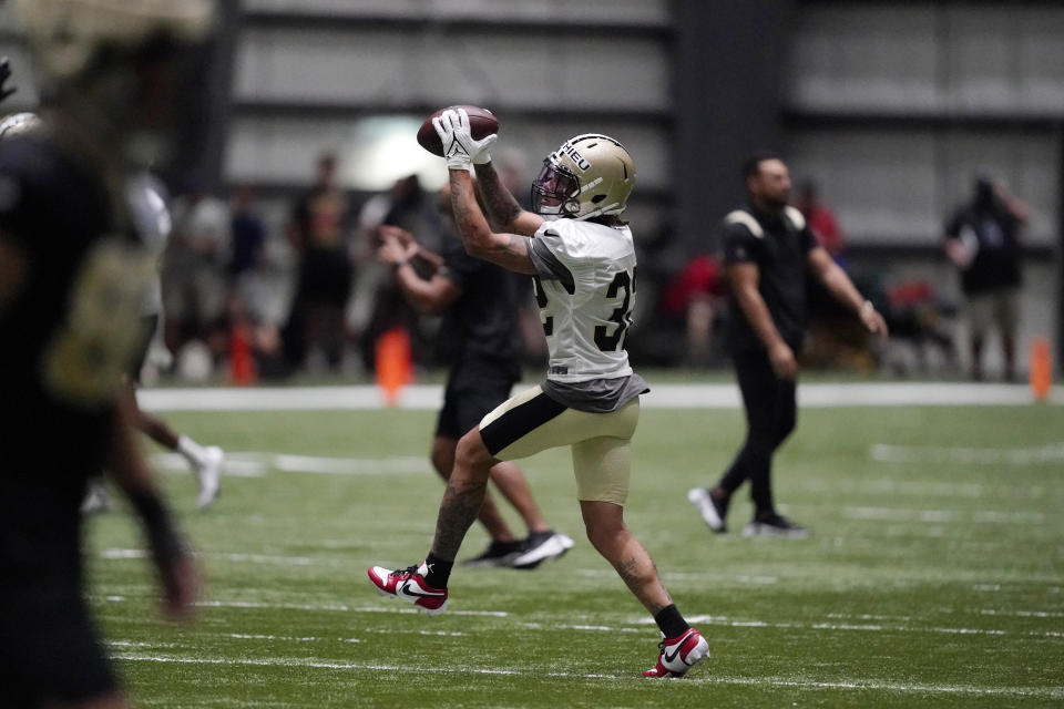 New Orleans Saints cornerback Tyrann Mathieu (32) runs through drills during training camp at the team's NFL football training facility in Metairie, La., Wednesday, Aug. 3, 2022. (AP Photo/Gerald Herbert)