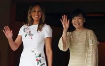 U.S. first lady Melania Trump and Akie Abe, wife of Japanese Prime Minister Shinzo Abe wave while viewing the koi carp pond at Akasaka State Guest House in Tokyo, Japan May 27, 2019. REUTERS/Athit Perawongmetha