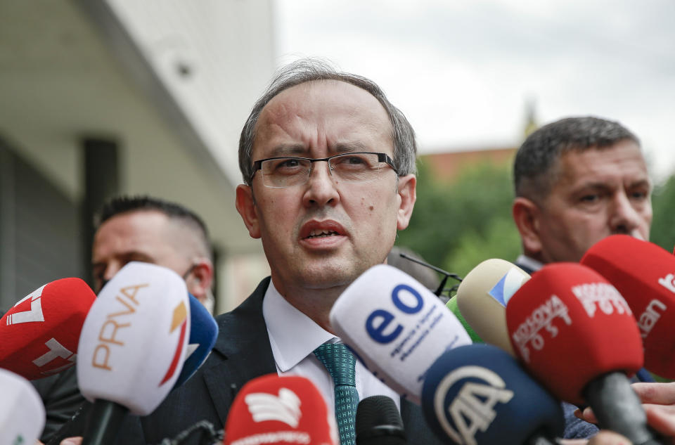 Newly elected prime minister Avdullah Hoti, speaks to the media, in the capital Pristina, Wednesday, June 3, 2020. Kosovo’s parliament voted in a new prime minister Wednesday to lead a fragile coalition government that will inherit the economic impact of the coronavirus pandemic and stalled normalization talks with neighboring Serbia. (AP Photo/Visar Kryeziu)