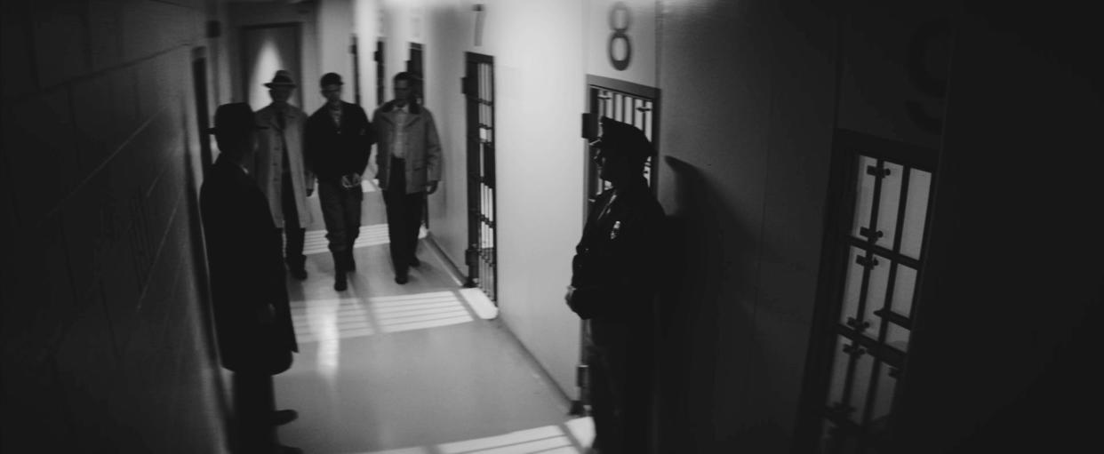 In this recreation, Wisconsin serial killer Ed Gein is escorted down a hallway in the Waushara County Jail. Recordings of an interview with Gein in the jail the night he was arrested in 1957 are the heart of a new documentary series "Psycho: The Lost Tapes of Ed Gein."