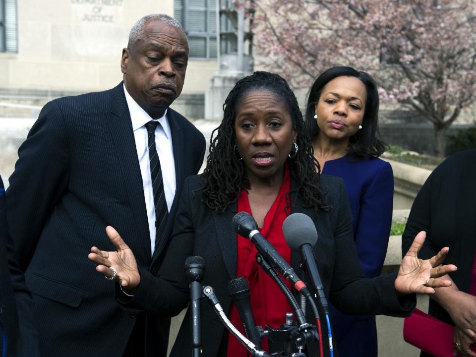 Sherrilyn Ifill, president and director-counsel, NAACP Legal Defense and Education Fund, center, speaks with the news media outside of the Justice Department, as Wade Henderson, president of the Leadership Conference on Civil and Human Rights, left, and Kristen Clarke, The Lawyer's Committee for Civil Rights Under Law, look on following their meeting with Attorney General Jeff Sessions, in Washington, Tuesday, March 7, 2017. (AP Photo/Cliff Owen)