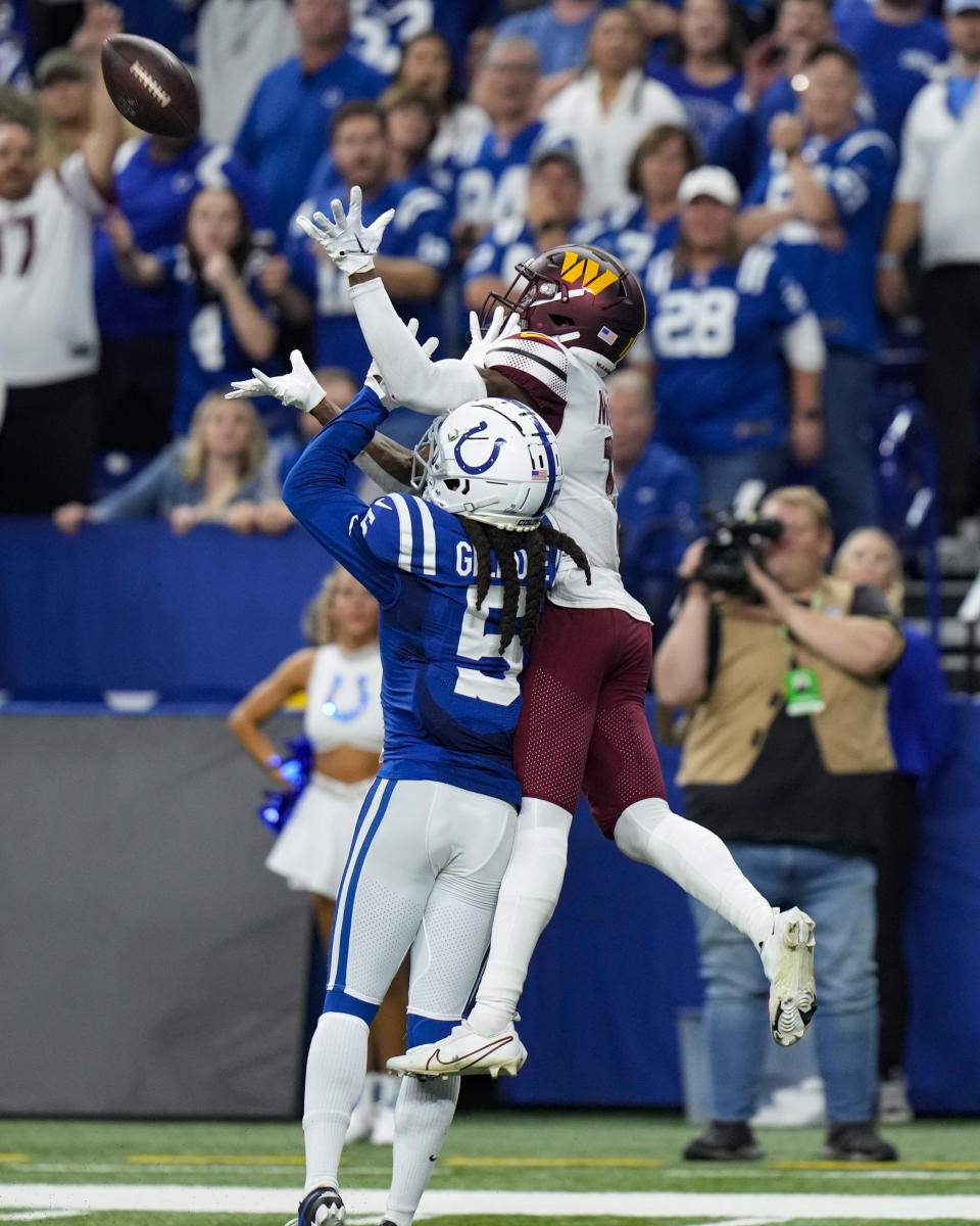 Washington Commanders wide receiver Terry McLaurin (17) makes a catch over Indianapolis Colts cornerback Stephon Gilmore (5) in the last minute of the second half of an NFL football game in Indianapolis, Fla., Sunday, Oct. 30, 2022. (AP Photo/AJ Mast)