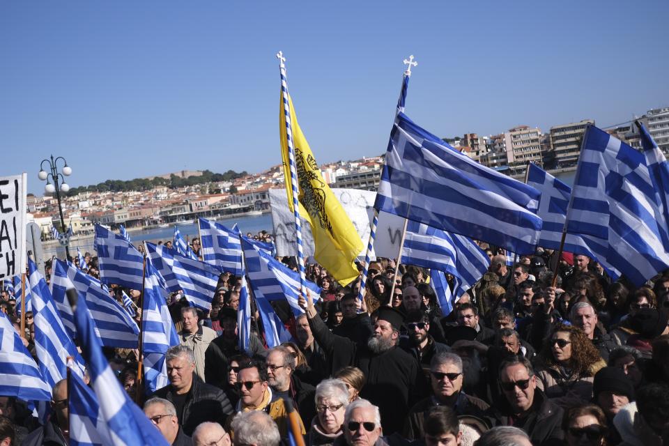 Protesters take part in a rally outside the Municipality of Mytilene, on the northeastern Aegean island of Lesbos, Greece, on Wednesday, Jan. 22, 2020. Local residents and business owners have launched a day of protest on the Greek islands hardest hit by migration, demanding the Greek government ease severe overcrowding at refugee camps. (AP Photo/Aggelos Barai)