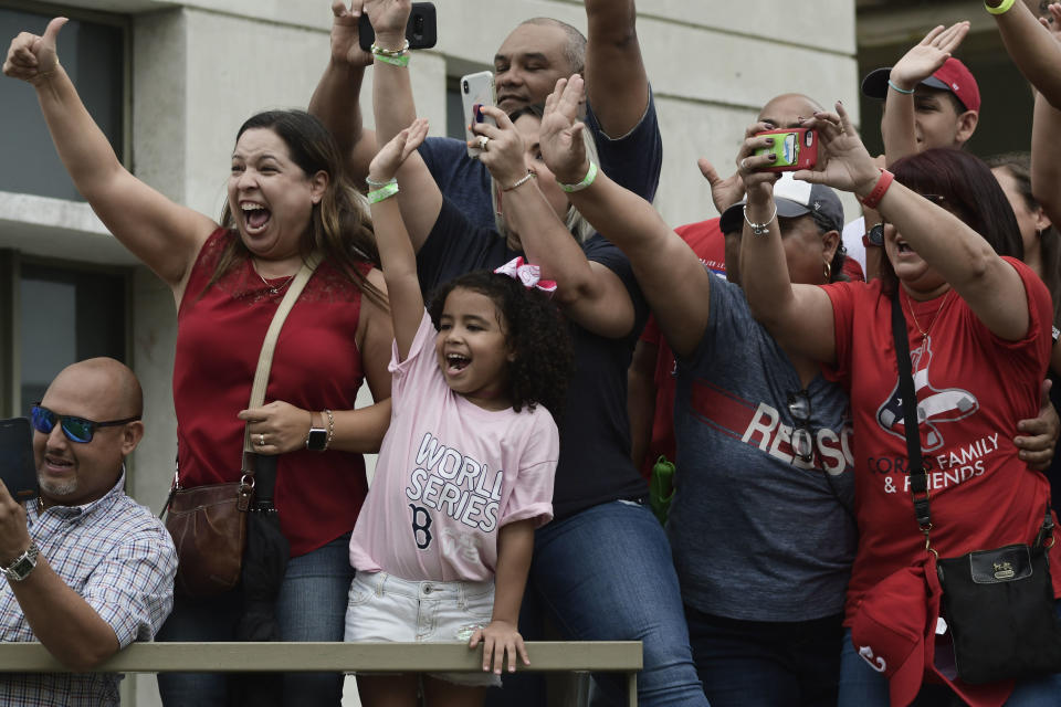 Fans celebrate Boston Red Sox manager Alex Cora's arrival to his hometown with the 2018 World Series trophy, accompanied by Chairman Tom Werner and President and CEO Sam Kennedy, as well as seven Red Sox players and coaches, in Caguas, Puerto Rico, Saturday, Nov. 3, 2018. (AP Photo Carlos Giusti)