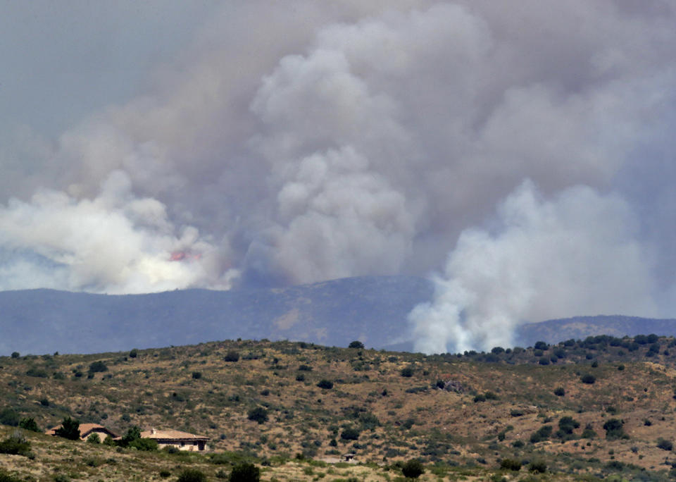 <p>A fire burns near Mayer, Ariz, Wednesday, June 28, 2017, as seen from Spring Valley, Ariz. The fire has burned over 28 square miles (73 square kilometers). More than 500 firefighters are battling the blaze that’s near the small town where 19 members of an elite firefighting unit were killed while battling a blaze four years ago. (AP Photo/Matt York) </p>