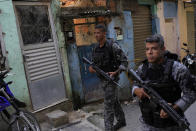 Military police occupy the Jacarezinho favela in Rio de Janeiro, Brazil, Wednesday, Jan. 19, 2022. Military police started to occupy the favela as the first phase of Rio de Janeiro state government's new program against organized crime and promises of social interventions. (AP Photo/Silvia Izquierdo)