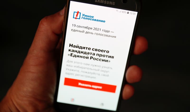 The Russian opposition politician Alexei Navalny's Smart Voting app is seen on a phone, in Moscow