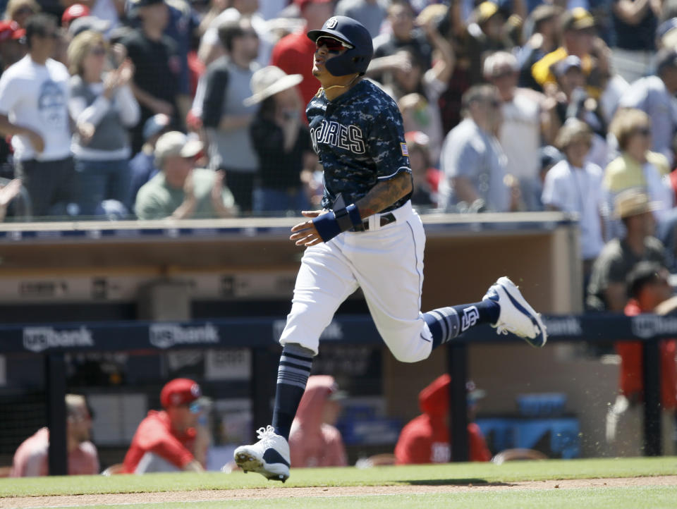 San Diego Padres' Manny Machado scores on a two-run double by Wil Myers during the third inning of a baseball game against the Cincinnati Reds in San Diego, Sunday, April 21, 2019. (AP Photo/Alex Gallardo)