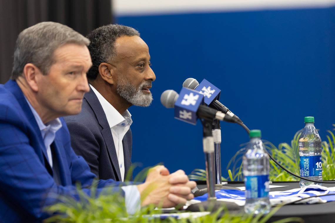 Kenny Brooks, right, spoke during his introductory press conference as the head coach of Kentucky women’s basketball with UK athletics director Mitch Barnhart in the foreground. “I think this is a sleeping giant,” Brooks said of Kentucky women’s basketball. Silas Walker/swalker@herald-leader.com