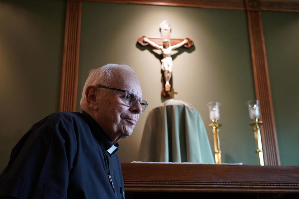 Monsignor Michael Picard, of St. Andrew Roman Catholic Church, pauses while speaking during an interview, Monday, July 17, 2023, in Newtown, Pa. Emergency crews in suburban Philadelphia intensified their search Monday for a missing 9-month-old boy and his 2-year-old sister who were swept away in a family car when torrential rains flooded a roadway. Picard the pastor where family members are parishioners, said he spoke with the grandparents Sunday. The grandfather attended morning Mass on Monday, where the family was included in prayers. (AP Photo/Matt Slocum)