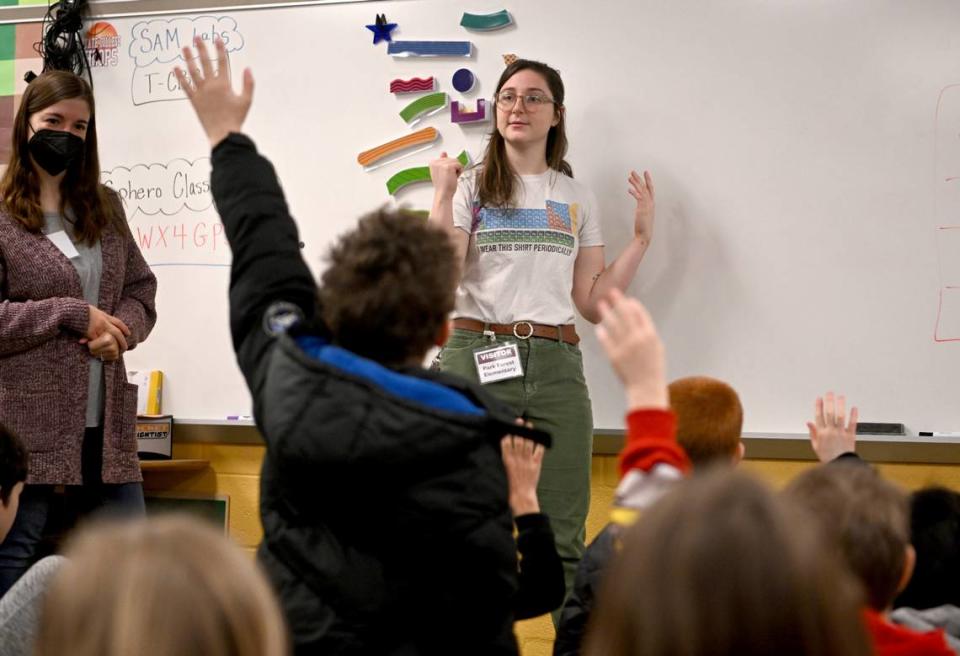 Penn State graduate student Emma Steinbebronn talks about circuits to fourth graders during the STEM class at Park Forest Elementary on Thursday.
