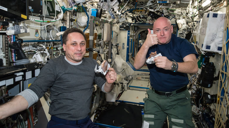 astronauts eating food in space