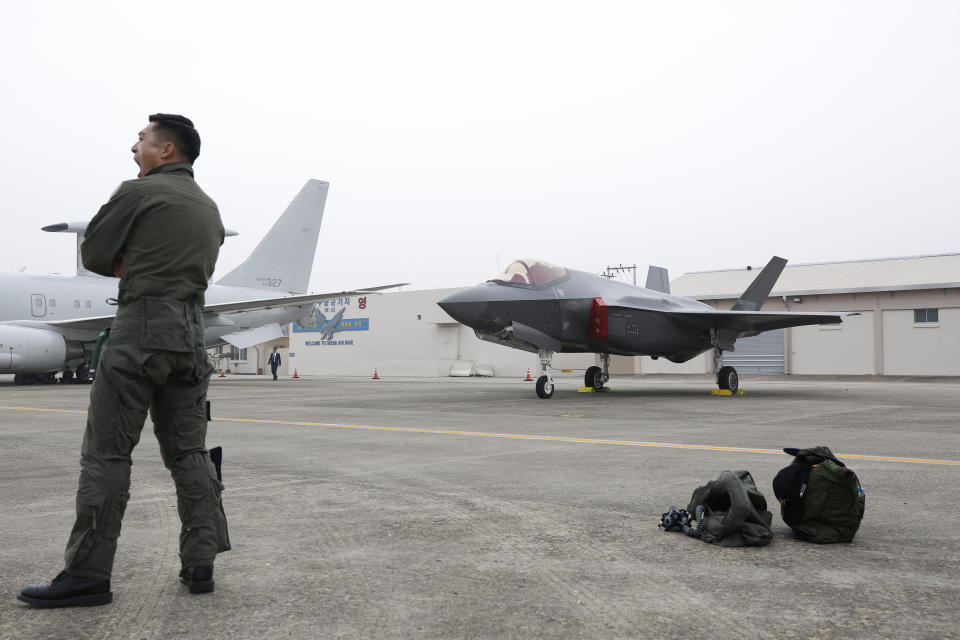 A South Korean fighter pilot stands near F-35 A Stealth in the 71st anniversary of Armed Forces Day at the Air Force Base in Daegu, South Korea Tuesday, Oct. 1, 2019. (Jeon Heon-kyun/Pool Photo via AP)