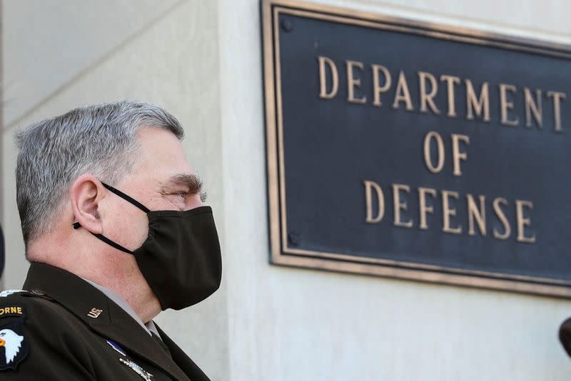 FILE PHOTO: U.S. Joint Chiefs Chairman Milley awaits arrival of newly confirmed U.S. Defense Secretary Austin at the Pentagon in Arlington, Virginia