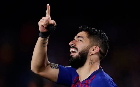 Barcelona's Luis Suarez celebrates scoring his side's first goal during the Champions League semifinal first leg soccer match between FC Barcelona and Liverpool at the Camp Nou stadium in Barcelona, Spain, Wednesday, May 1, 2019. - Credit: AP Photo/Manu Fernandez