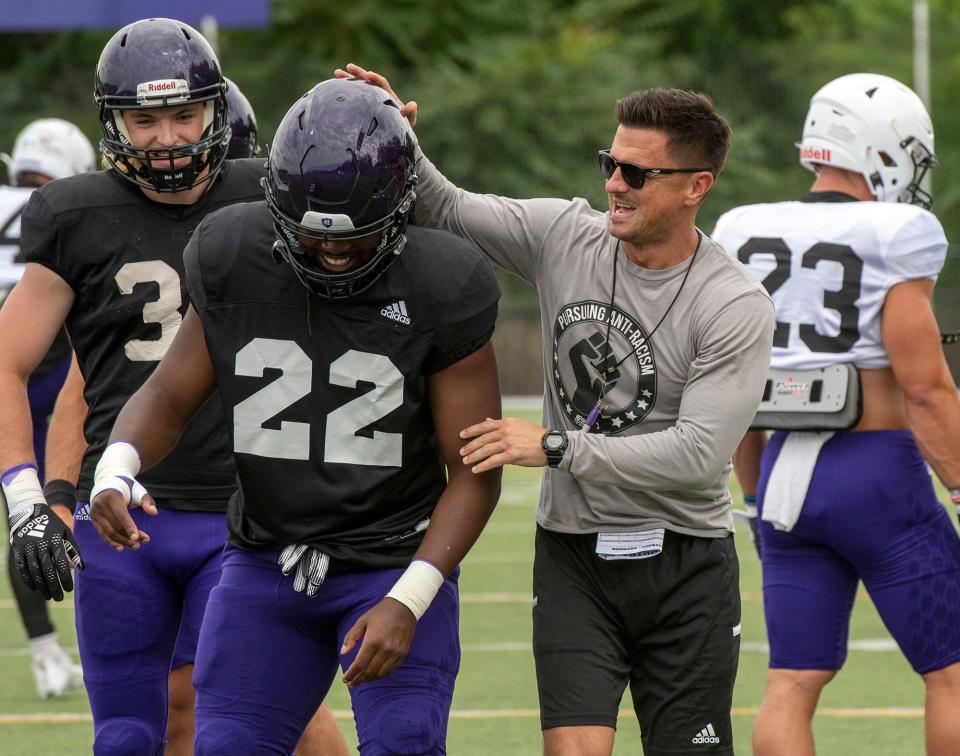 Holy Cross football coach Bob Chesney leads a practice earlier this year.