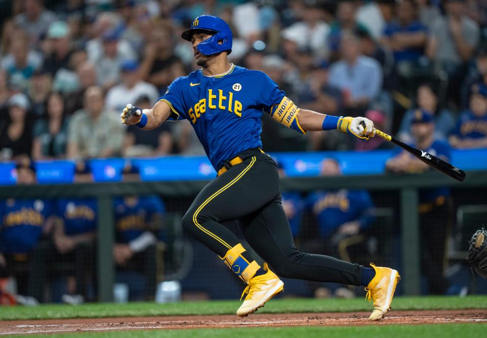 Mariners star Julio Rodriguez follows through on a single against the Dodgers at T-Mobile Park in Seattle on Sept. 15, 2023.