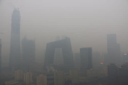 Buildings are seen in smog during a polluted day in Beijing, China, January 26, 2017. REUTERS/Stringer