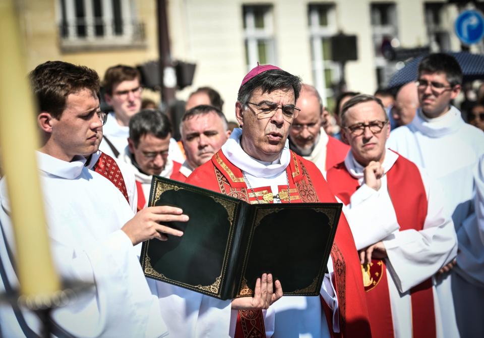 Paris Archbishop Michel Aupetit leads Holy Week celebrations near Notre Dame Cathedral on April 19, 2019, four days after a fire engulfed the 850-year-old Gothic masterpiece. (STEPHANE DE SAKUTIN via Getty Images)