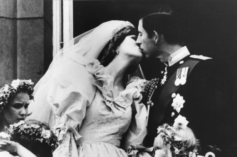 The Prince and Princess of Wales kiss on the balcony of Buckingham Palace after their wedding at St. Paul's Cathedral on July 27, 1981. UPI File Photo
