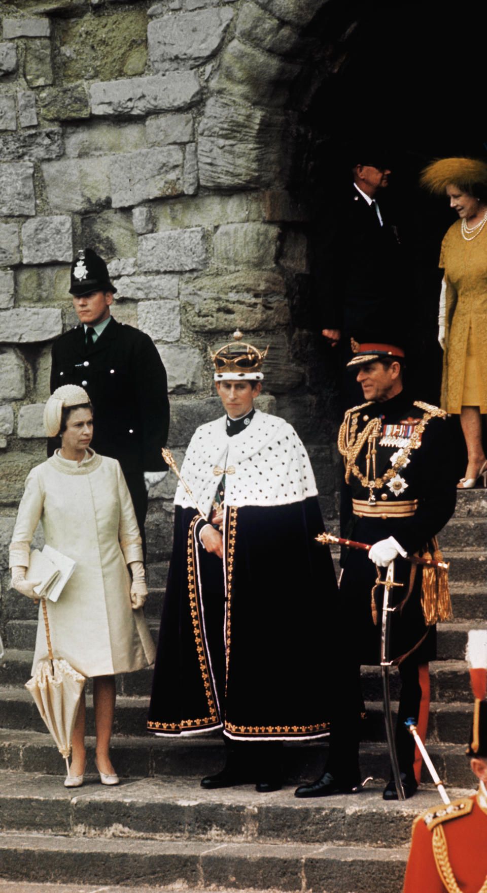 (Original Caption) Newly crowned Prince of Wales, Great Britain's Prince Charles, stands with his mother, Queen Elizabeth II (L); sister, Princess Anne; father, Prince Philip: and grandmother, Queen Mother Elizabeth, after investiture at Caernarvon Castle July 1st.