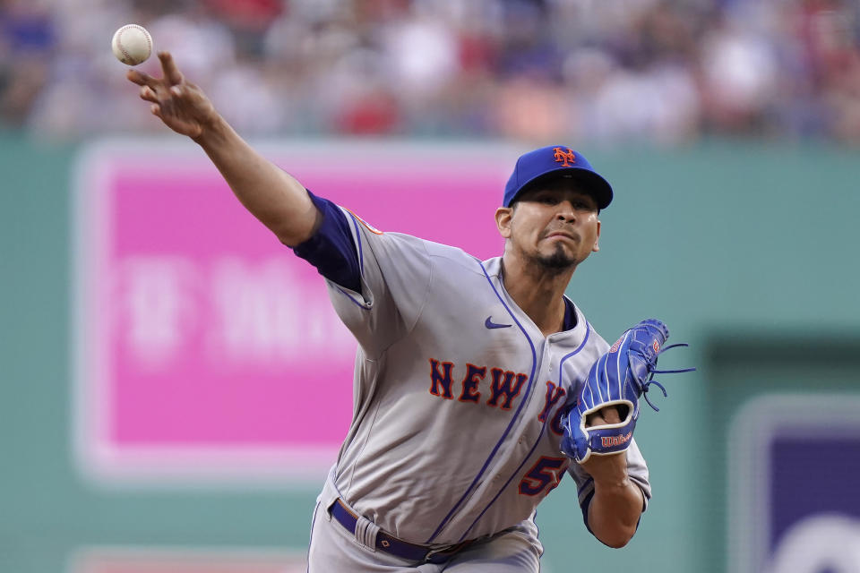 New York Mets' Carlos Carrasco delivers a pitch to a Boston Red Sox batter in the first inning of a baseball game, Sunday, July 23, 2023, in Boston. (AP Photo/Steven Senne)