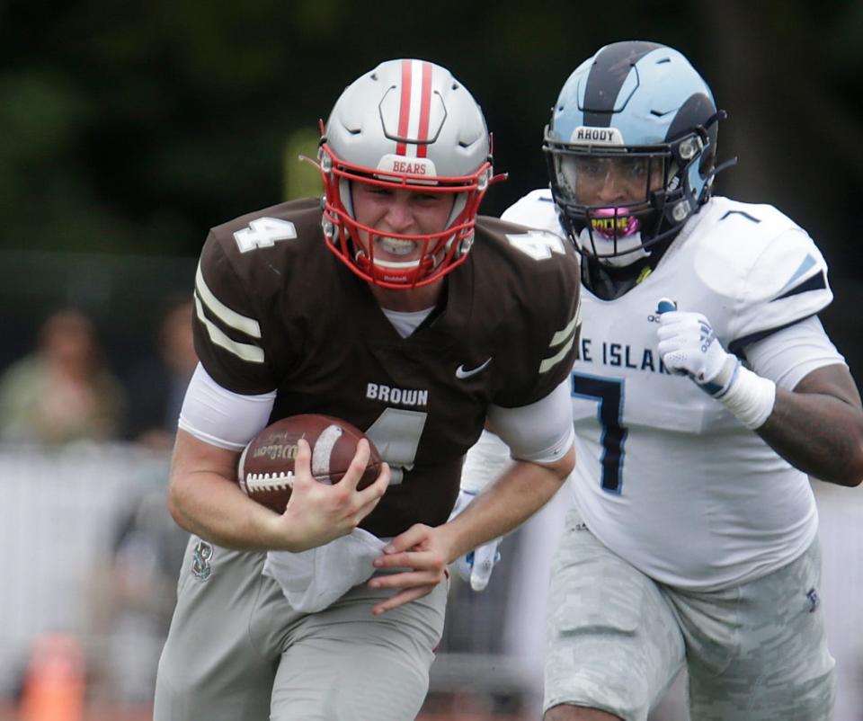 Bears quarterback EJ Perry scrambles for yardage during the game against the URI Rams on Sept. 18 at Brown Stadium.